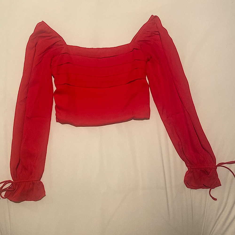 Francesca’s SMALL red blouse. New W/O Tags. 100% Polyester.